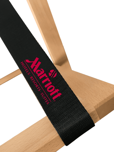 Wooden luggage rack with embroidered strap for hotels