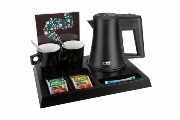 Wooden welcome tray of black MDF with black hotel kettle, leaflet holder and black cups
