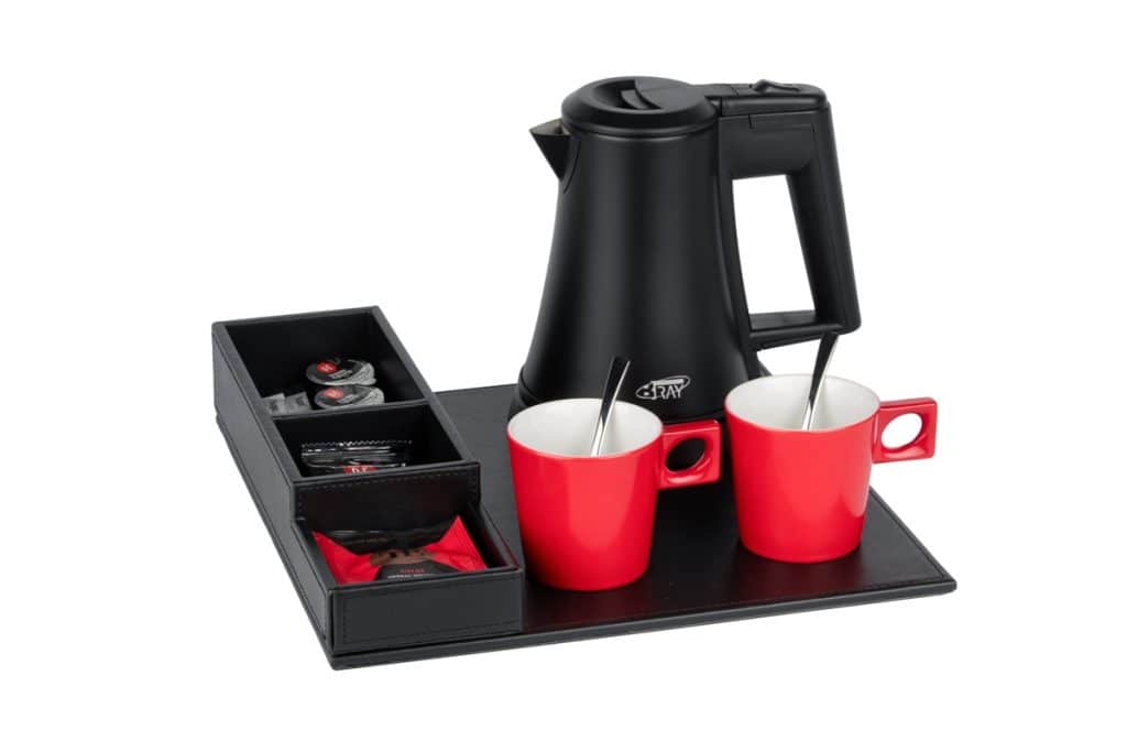 Budget friendly welcome tray of PU leather with black hotel kettle and red coffee cups