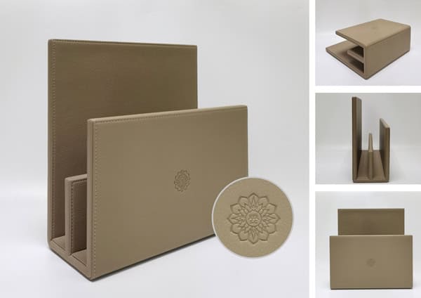 Custom magazine holder with logo made of beige faux leather