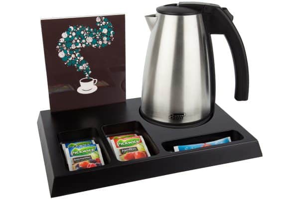 Black wooden welcome tray with large water kettle and brochure holder