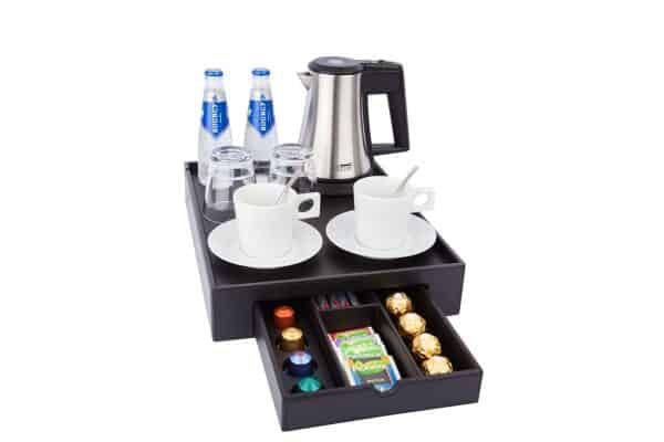 Tea and coffee facility for hotel guest room made of black fauw leather with drawer