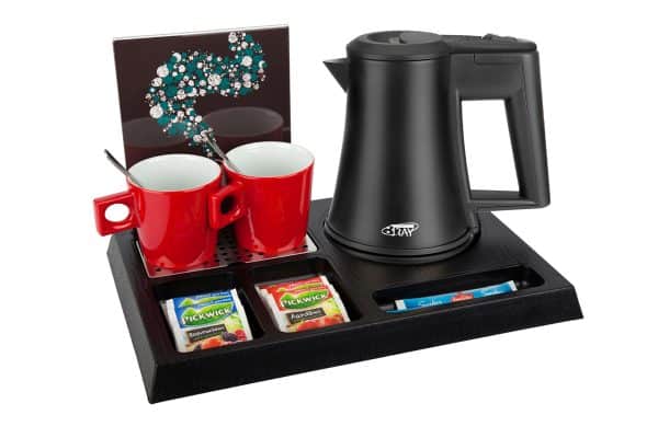 Black ABS hospitality tray with black 0.5 litre kettle, leaflet holder and red cups